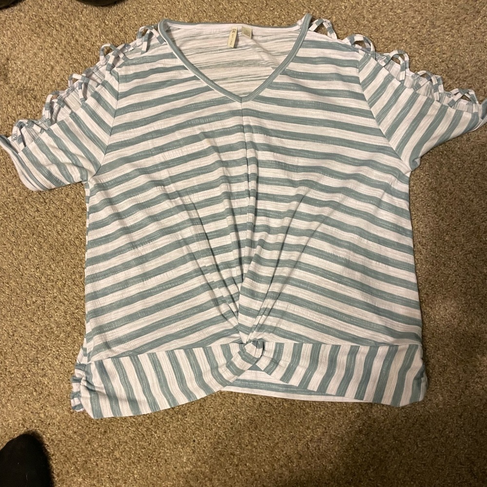 Stripped shirt with holes stripes on the top part of the shirt. Lg